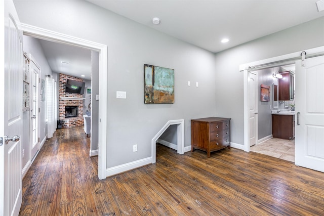 hall with dark hardwood / wood-style flooring