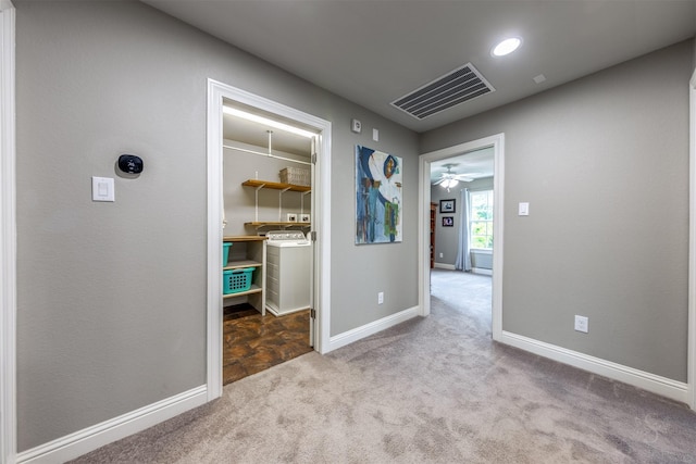 hall featuring light colored carpet