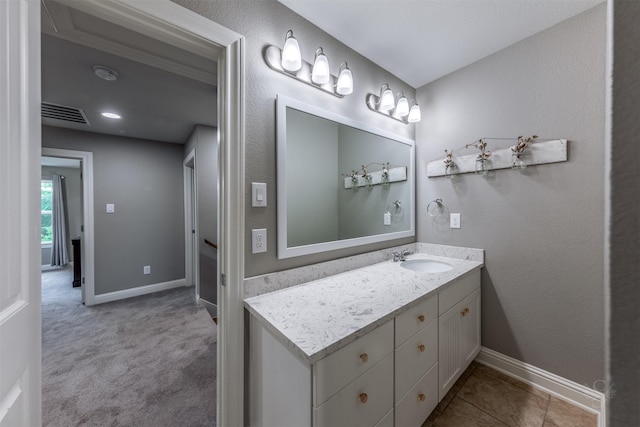 bathroom with tile patterned floors and vanity