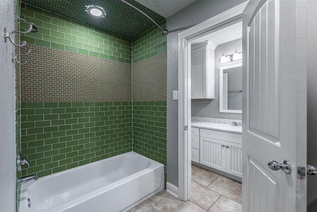 bathroom with vanity, tiled shower / bath combo, and tile patterned floors