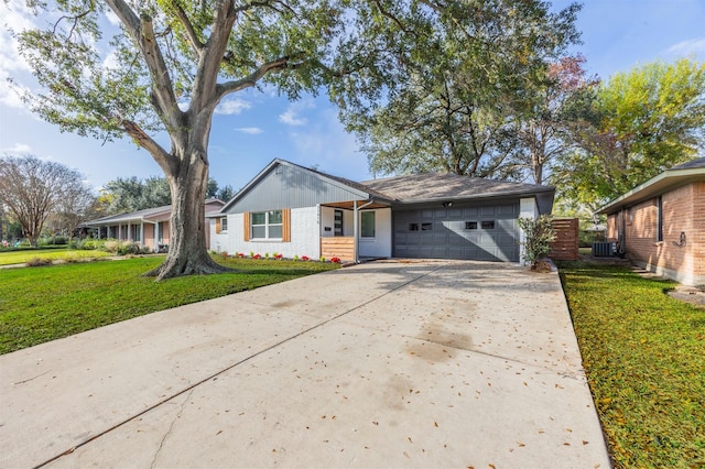 ranch-style home featuring central AC, a garage, and a front lawn