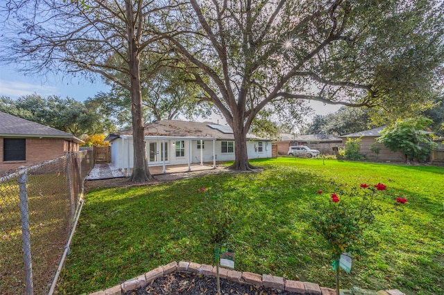 view of yard featuring french doors