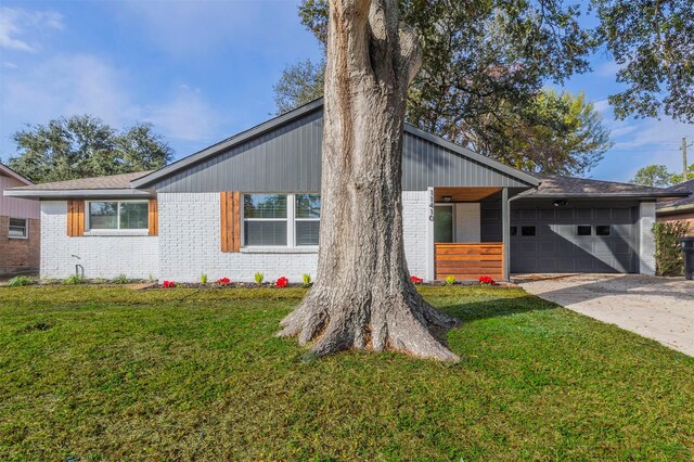 exterior space with a front yard and a garage