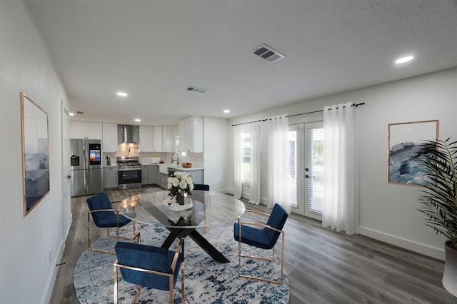 living room with hardwood / wood-style flooring and french doors