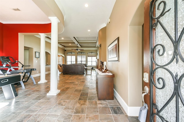 foyer entrance with ornate columns, crown molding, and coffered ceiling