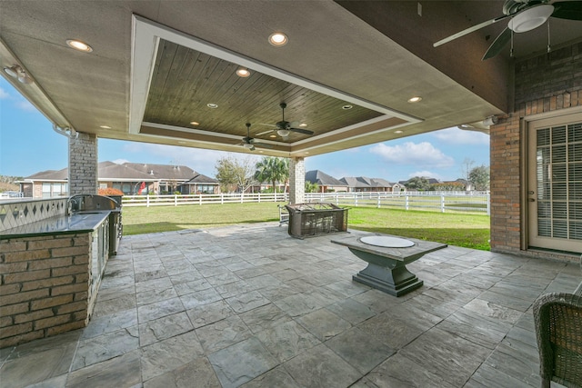 view of patio with ceiling fan and exterior kitchen