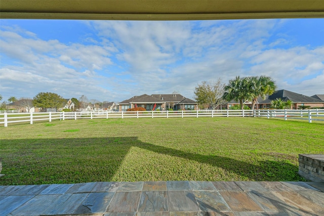 view of yard with a rural view