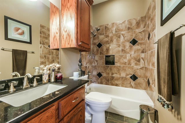 full bathroom with tile patterned floors, tiled shower / bath combo, toilet, and vanity