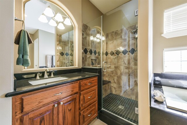 bathroom with vanity and walk in shower