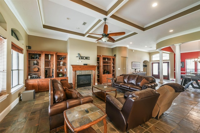 living room featuring coffered ceiling, crown molding, a fireplace, beamed ceiling, and decorative columns