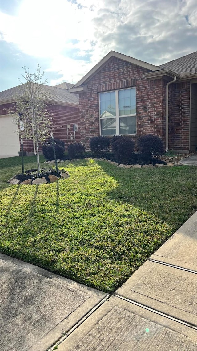 view of side of property with a yard