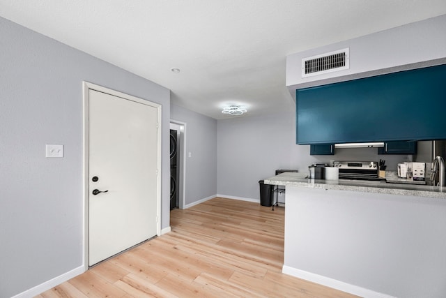 unfurnished office featuring light hardwood / wood-style flooring