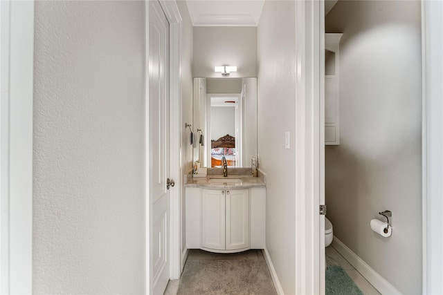 hall featuring ornamental molding, sink, and light tile patterned floors