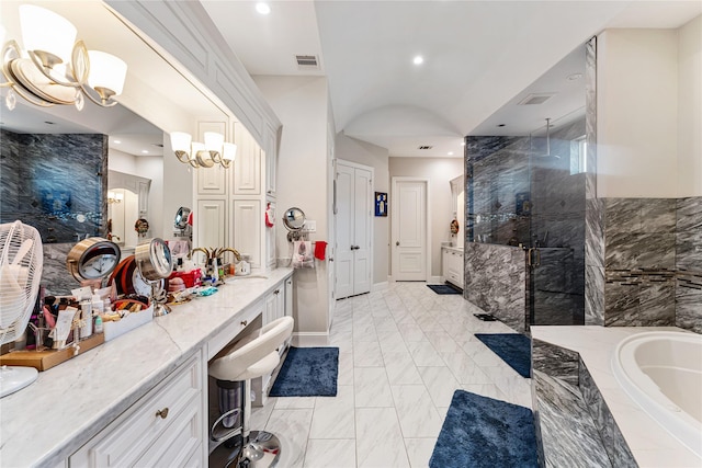 bathroom with vanity, plus walk in shower, and a chandelier