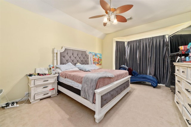 carpeted bedroom with ceiling fan and lofted ceiling