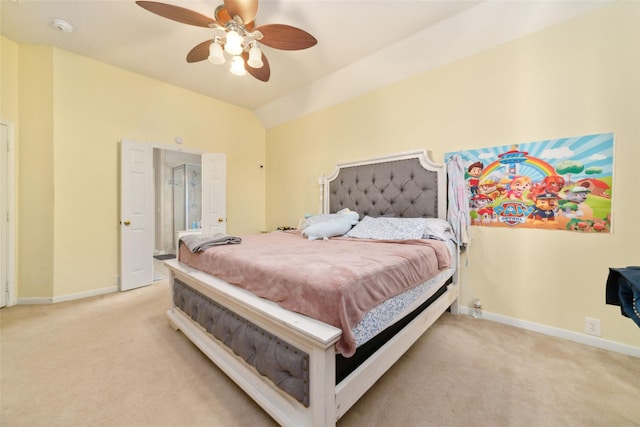 bedroom featuring light carpet, vaulted ceiling, and ceiling fan