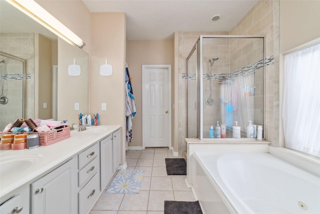 bathroom with shower with separate bathtub, vanity, tile patterned floors, and plenty of natural light