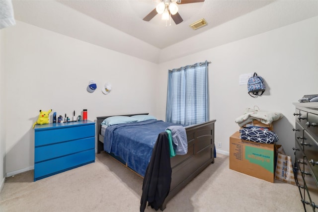 bedroom with ceiling fan and light colored carpet