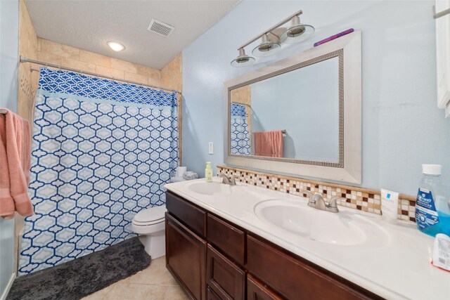 bathroom featuring walk in shower, tile patterned flooring, a textured ceiling, toilet, and vanity