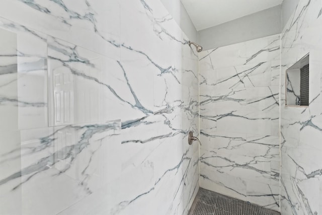 bathroom featuring tiled shower