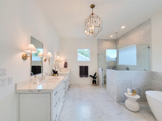 bathroom featuring vanity, ornamental molding, shower with separate bathtub, and an inviting chandelier