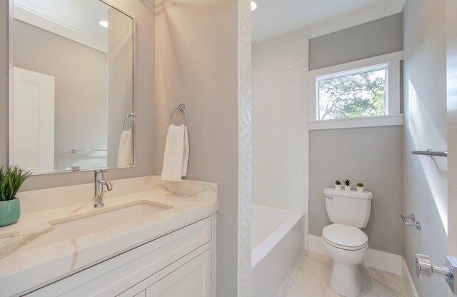 full bathroom featuring shower / tub combination, vanity, and toilet