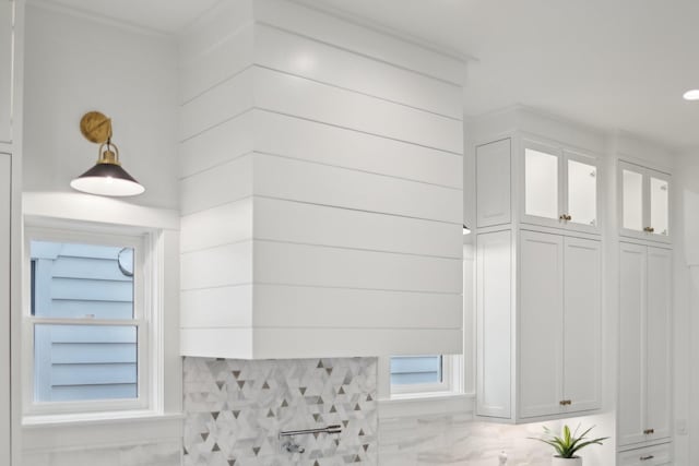 interior details featuring white cabinetry