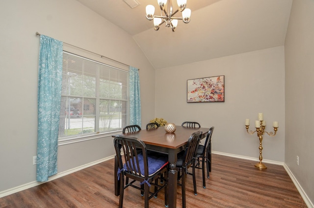 dining area with a notable chandelier, lofted ceiling, and dark wood-type flooring