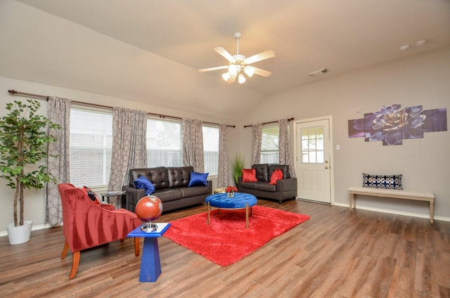 living room featuring wood-type flooring, vaulted ceiling, and ceiling fan