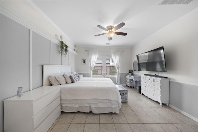 bedroom featuring ceiling fan, ornamental molding, and light tile patterned flooring