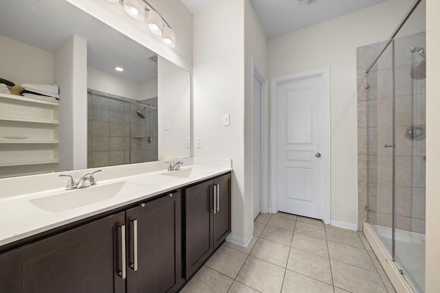 bathroom featuring vanity, tile patterned floors, and walk in shower