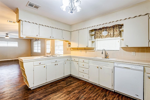 kitchen with plenty of natural light, sink, white cabinets, and white appliances