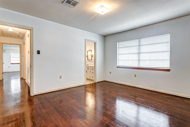 unfurnished room featuring dark hardwood / wood-style floors