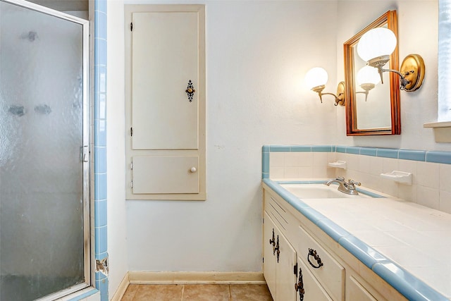 bathroom featuring vanity, tile patterned floors, and an enclosed shower