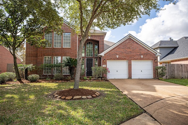 front of property featuring a front yard and a garage