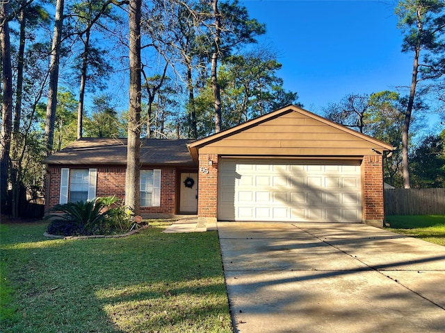 ranch-style home with a garage and a front lawn