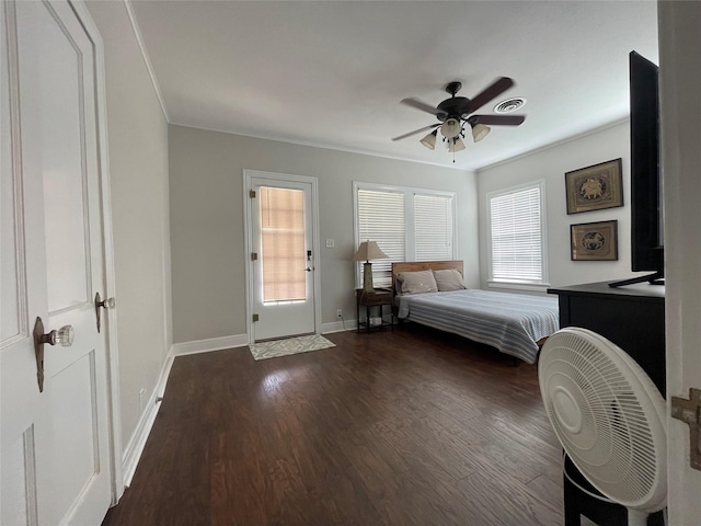 unfurnished bedroom with ceiling fan, dark wood-type flooring, and multiple windows