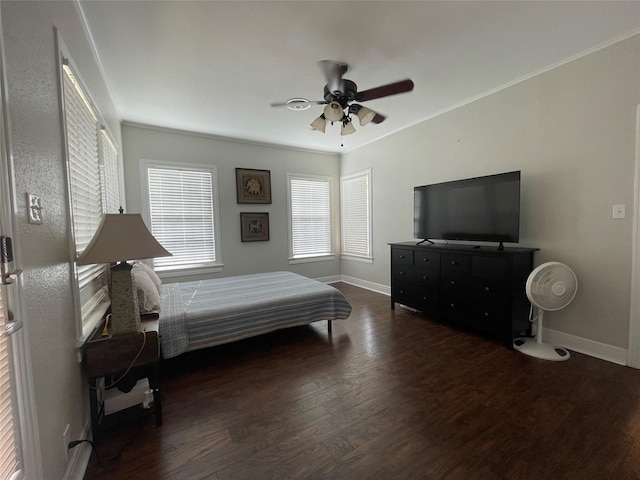 bedroom with ceiling fan and dark wood-type flooring