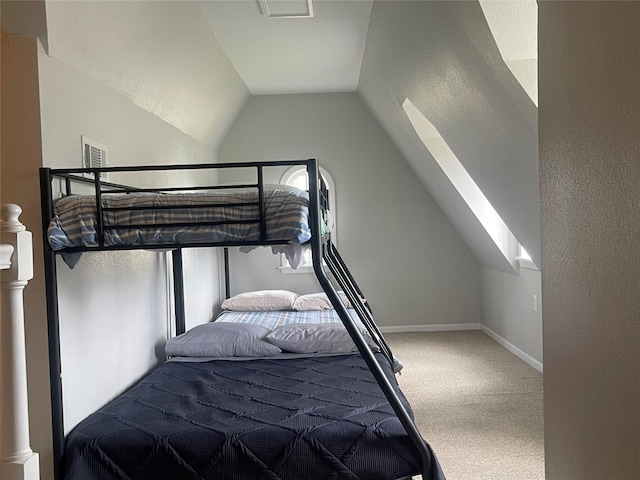 carpeted bedroom featuring vaulted ceiling