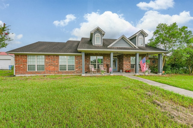 view of front of home with a front lawn and covered porch