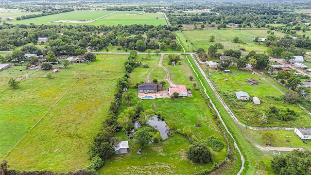 drone / aerial view featuring a rural view and a water view