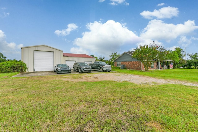 view of yard with an outbuilding and a garage