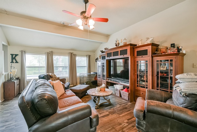 living room with lofted ceiling with beams, ceiling fan, and wood-type flooring