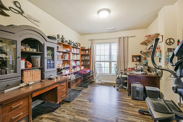 office area featuring dark hardwood / wood-style flooring and a textured ceiling