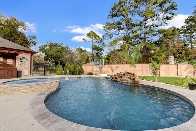 view of swimming pool featuring an in ground hot tub and pool water feature