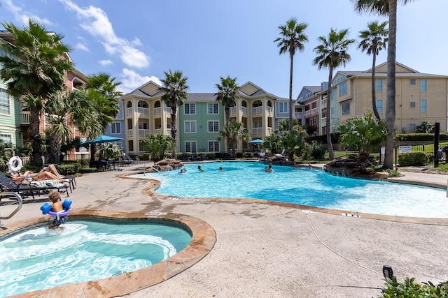 view of pool with a community hot tub