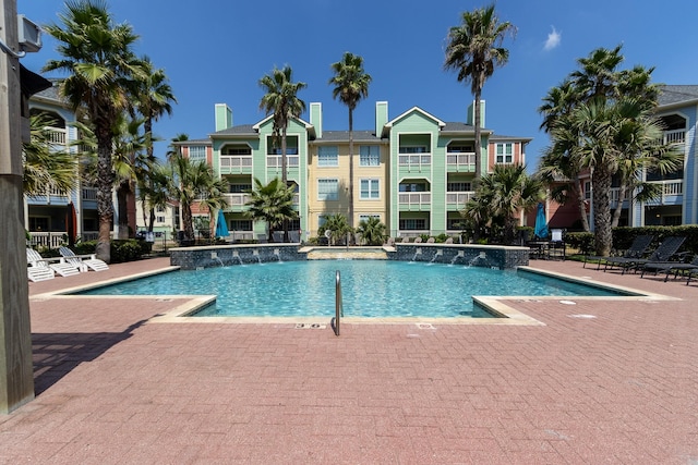 view of pool featuring pool water feature