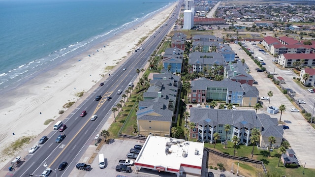 bird's eye view featuring a beach view and a water view