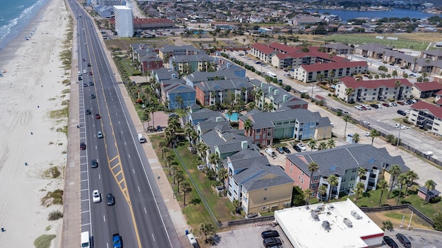 bird's eye view with a water view and a view of the beach