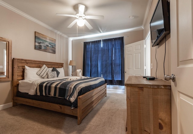 carpeted bedroom with ceiling fan and ornamental molding